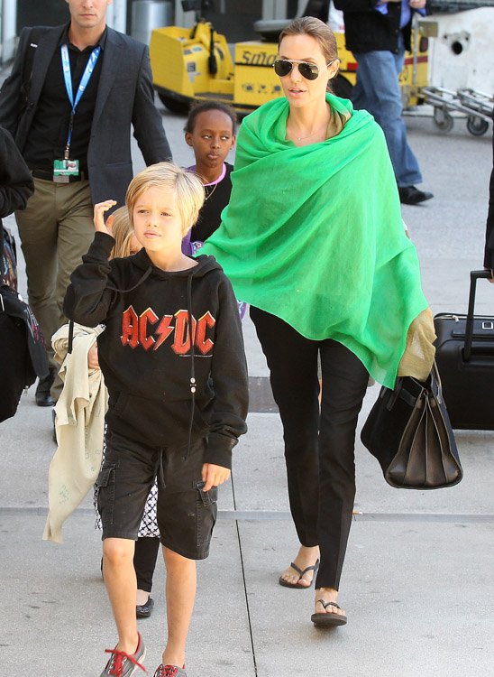 Reference image illustrating Angelina Jolie’s Go-To Travel Bag: The Saint Laurent Sac de Jour Suede Tote