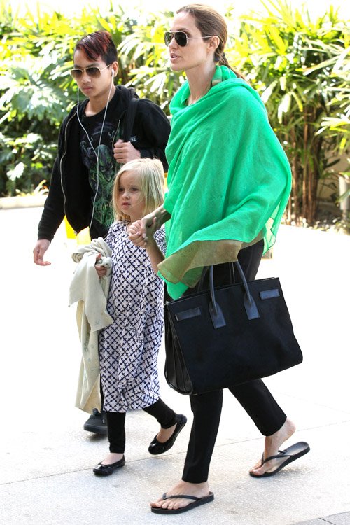 Reference image illustrating Angelina Jolie’s Go-To Travel Bag: The Saint Laurent Sac de Jour Suede Tote