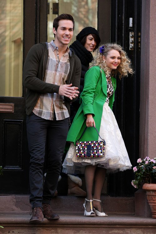 Reference image illustrating AnnaSophia Robb Spotted On Set With a Fendi Multicolor Mosaic Baguette Bag
