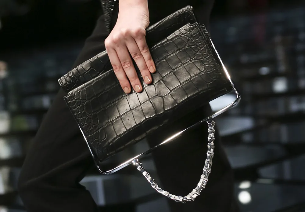 Reference image illustrating Balenciaga Spring 2015 Handbags: Alexander Wang's Refined Exotic Clutches and Top-Handle Designs