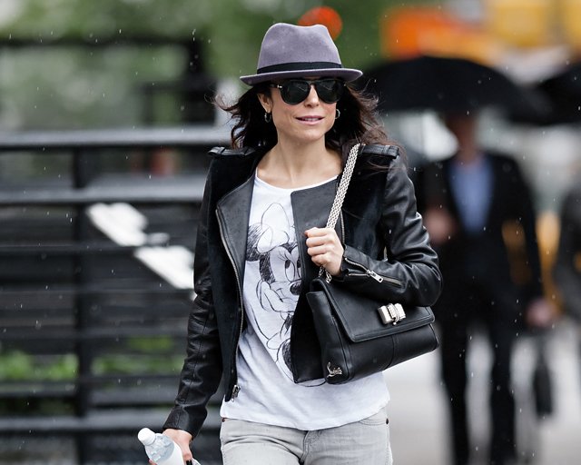 Reference image illustrating Bethenny Frankel Braving NYC Rain with a Christian Louboutin Sweet Charity Shoulder Bag