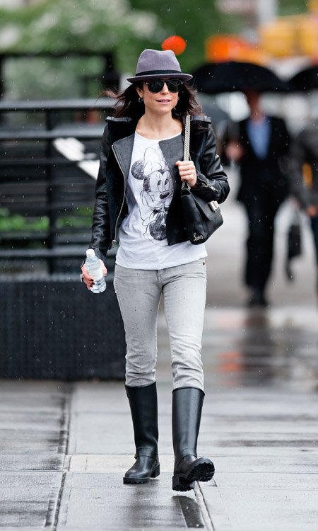 Reference image illustrating Bethenny Frankel Braving NYC Rain with a Christian Louboutin Sweet Charity Shoulder Bag