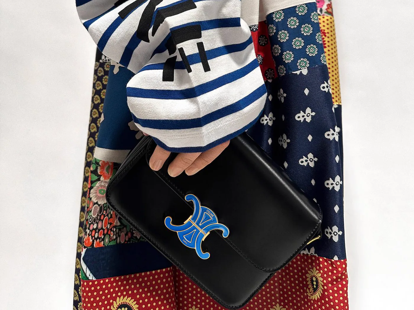 Reference image illustrating Celine Teen Triomphe Automne 2026: Michael Rider Adds Enamel Hardware to a House Icon