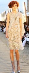 Reference image illustrating Chanel Cruise 2010 Collection: Venetian Boardwalk Glamour and Retro Resort Wear