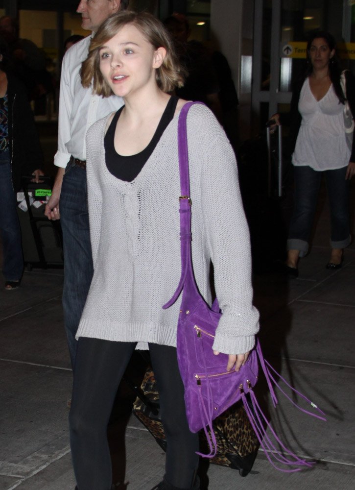 Reference image illustrating Chloë Grace Moretz’s Handbag Collection: From Chanel Classics to Coach Favorites