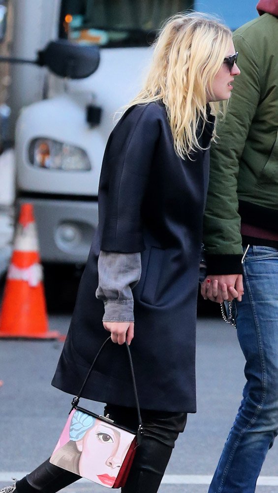 Reference image illustrating Dakota and Elle Fanning's Designer Handbag Collections: A Complete Style Guide