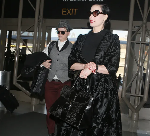 Reference image illustrating Dita Von Teese Spotted at LAX with a Rare Delvaux Astrakhan Brillant GM Bag