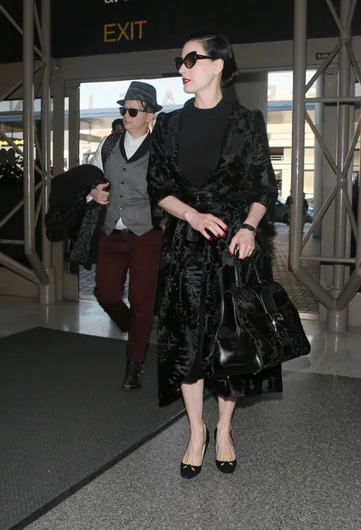 Reference image illustrating Dita Von Teese Spotted at LAX with a Rare Delvaux Astrakhan Brillant GM Bag