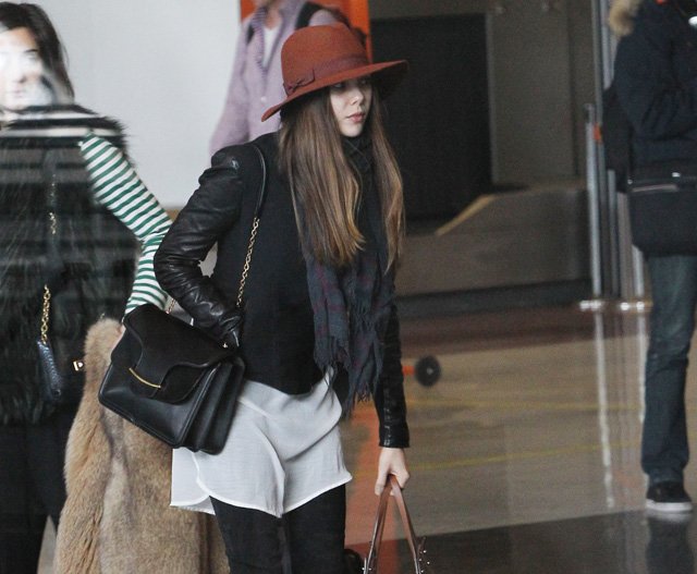 Reference image illustrating Elizabeth Olsen’s Paris Airport Style: Alexander McQueen Heroine Bag and Chanel Carry-On