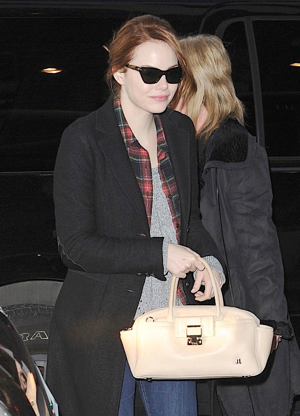Reference image illustrating Emma Stone's Handbag Collection: From Alexander Wang to Lanvin Clutches
