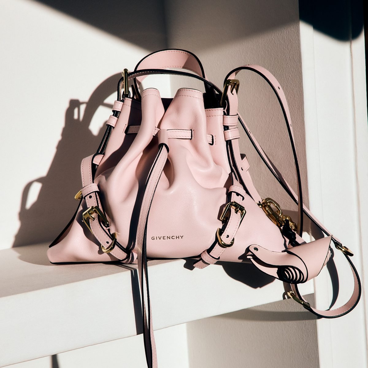 Reference image illustrating Givenchy Voyou Bucket Bag: A New Everyday Silhouette with Drawstring Closure and Crossbody Versatility