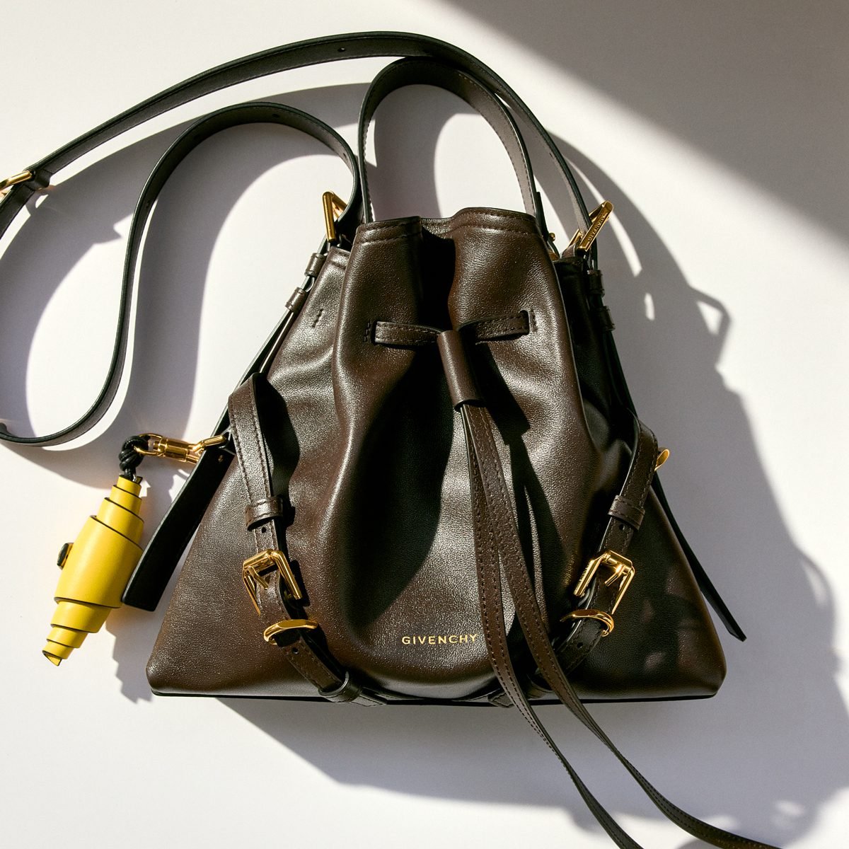 Reference image illustrating Givenchy Voyou Bucket Bag: A New Everyday Silhouette with Drawstring Closure and Crossbody Versatility