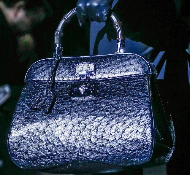 Reference image illustrating Gucci Fall 2013: Matte Black Bamboo Handles Get a Modern Makeover