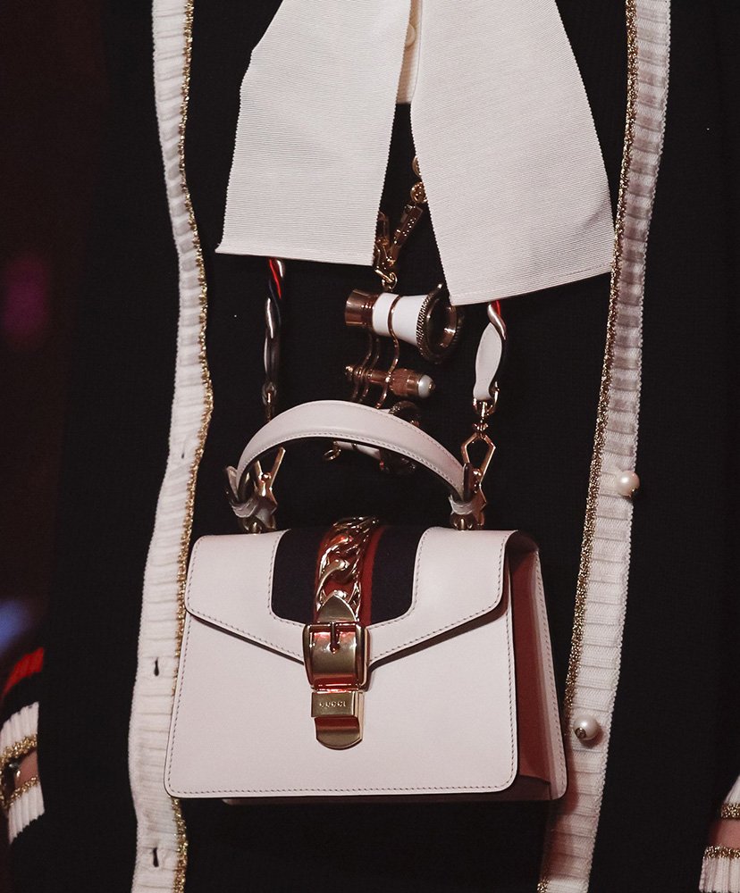 Reference image illustrating Gucci Spring 2017 Runway Bags: Chinoiserie Florals, Animal Clasps & Brocade Details