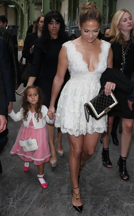 Reference image illustrating Jennifer Lopez and Daughter Emme Twin in Chanel at Paris Fashion Week
