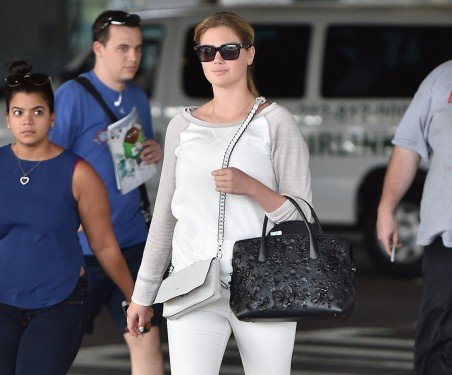 Kate Upton Travels in Style with Dior Bar Bag and Rag & Bone Enfield Mini Shoulder Bag cover image