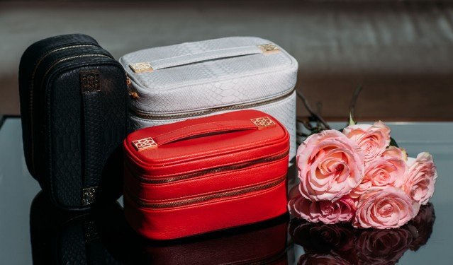 Kendra Scott Beauty Bags: Faux Python Train Cases and Cosmetic Organizers for Holiday Gifting cover image