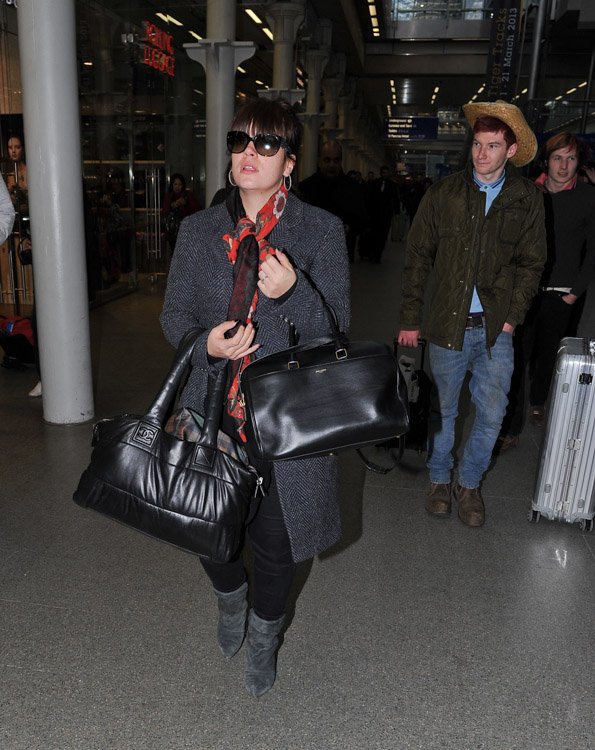 Reference image illustrating Lily Allen’s Chanel Coco Cocoon Tote and Saint Laurent Classic Duffel: A Train Station Style Study