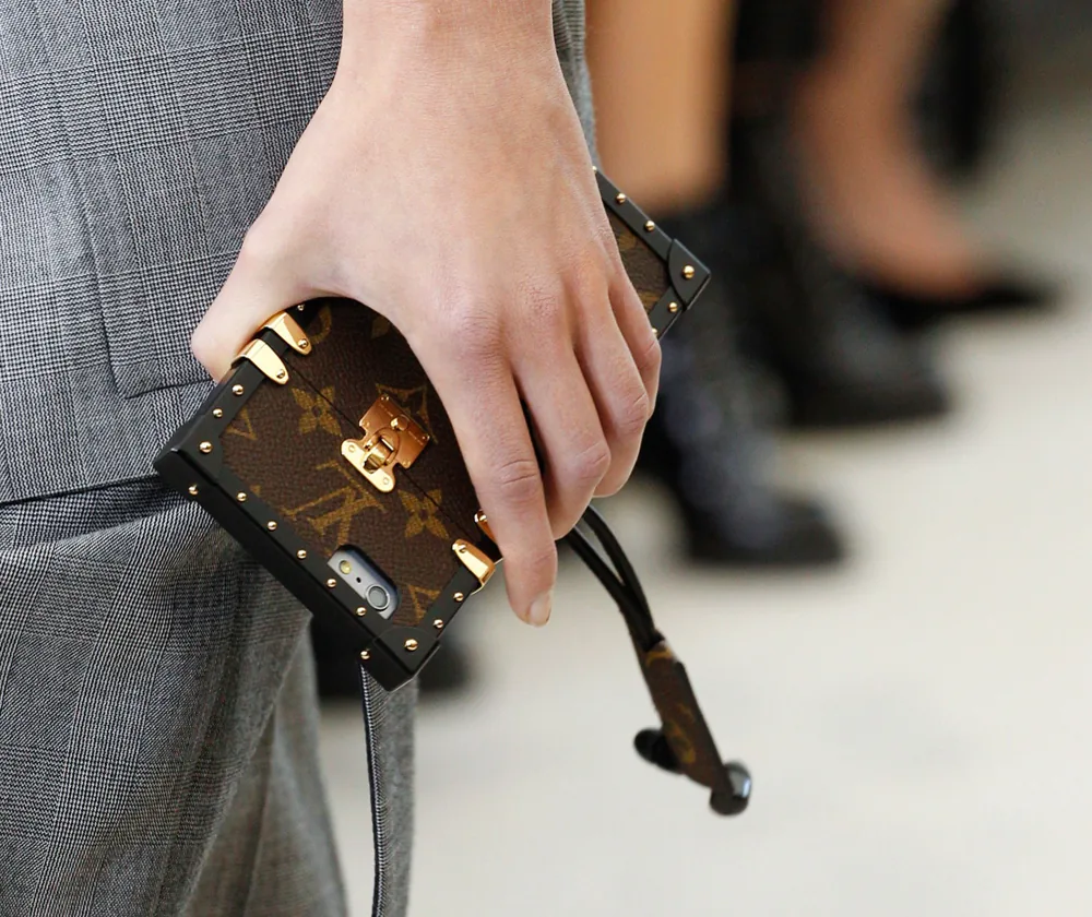 Reference image illustrating Louis Vuitton Etui iPhone 7 Case: Petite Malle-Inspired Luxury Phone Accessory Details