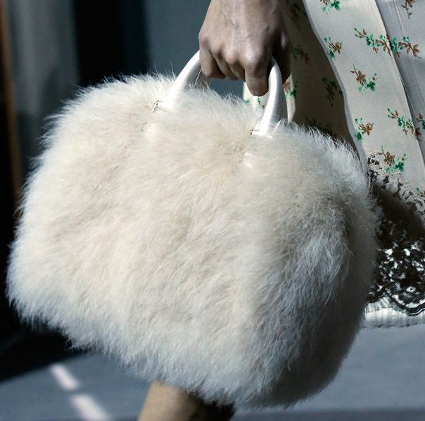 Reference image illustrating Louis Vuitton Fall 2013 Speedy Bag Reimagined in Fur, Python, and Feathers