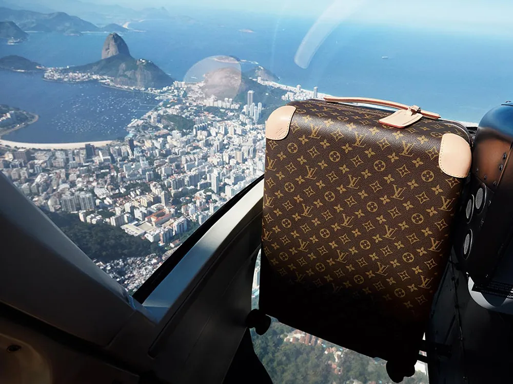 Reference image illustrating Louis Vuitton Rolling Luggage by Marc Newson: A Flat-Interior Travel Revolution