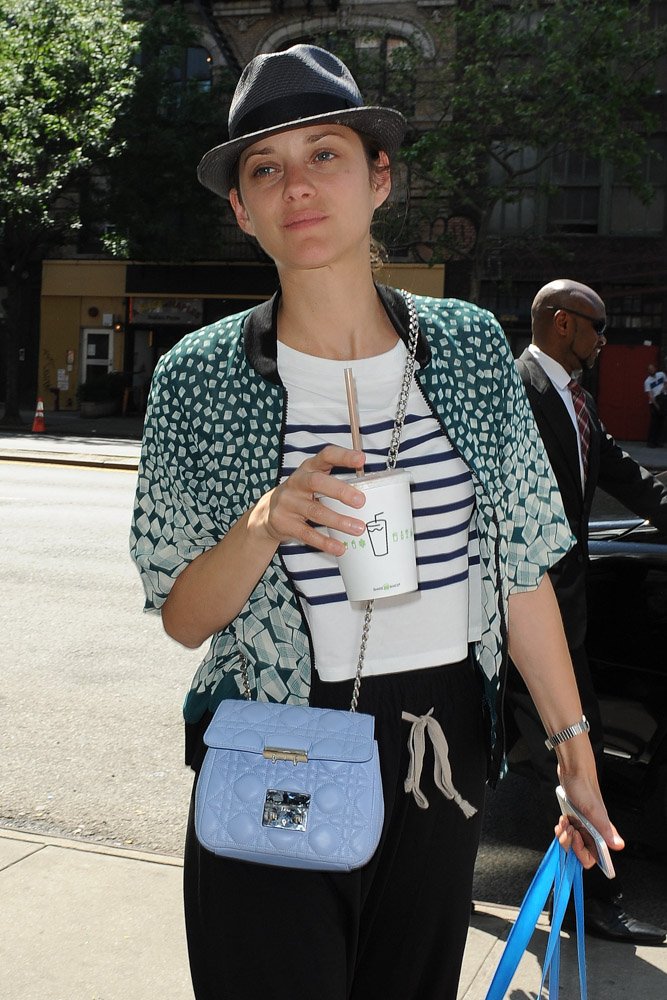 Reference image illustrating Marion Cotillard in NYC with a Pastel Blue Dior Miss Dior Mini Shoulder Bag