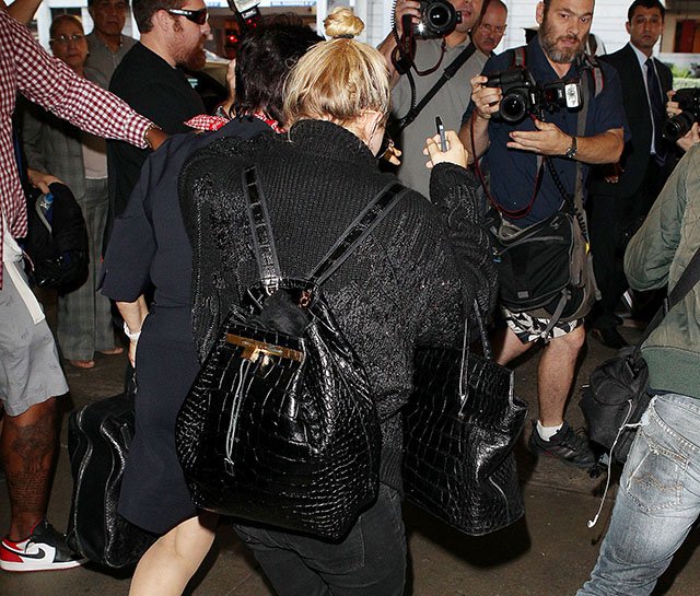 Reference image illustrating Mary-Kate Olsen Travels Through LAX with Nearly $80K in The Row Alligator Bags
