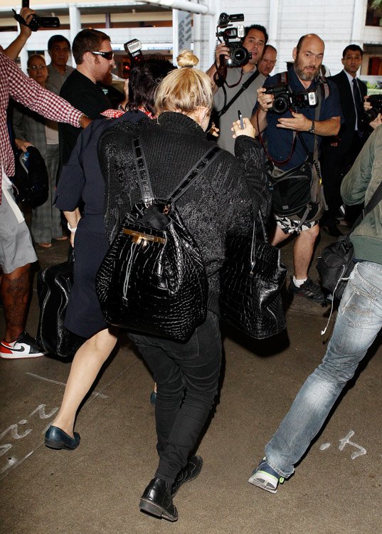 Reference image illustrating Mary-Kate Olsen Travels Through LAX with Nearly $80K in The Row Alligator Bags