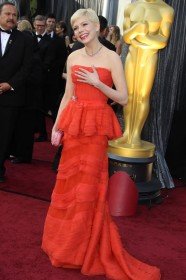 Reference image illustrating Michelle Williams at the 2012 Oscars: A Louis Vuitton Coral Dream and Bottega Veneta Knot Clutch