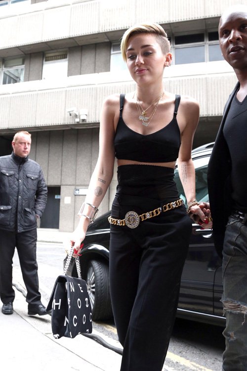 Reference image illustrating Miley Cyrus Spotted in London with a Vintage-Inspired Chanel Logo Flap Bag