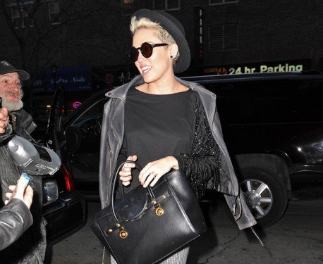 Miley Cyrus Spotted in NYC with the Versace Signature Tote: A Bold Street Style Moment cover image