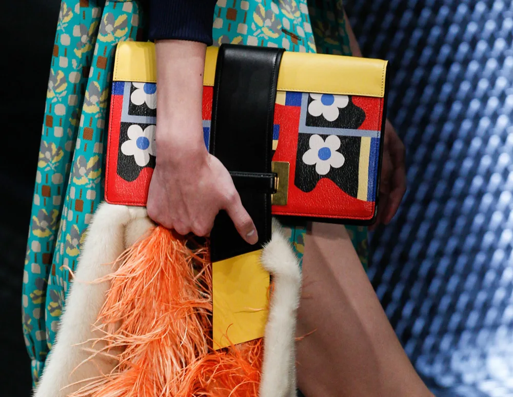 Reference image illustrating Prada Spring 2017 Introduces Two New Handbag Silhouettes: Chain-Strap Flap Bag and Duffel Satchel