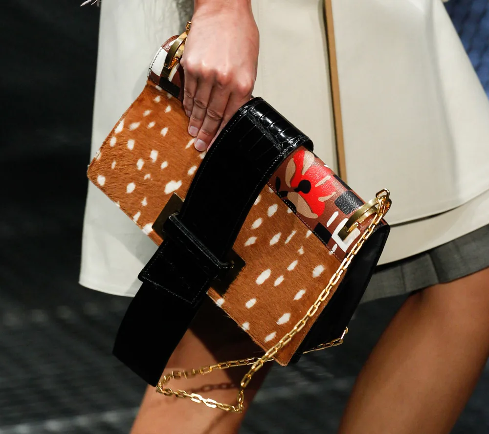 Reference image illustrating Prada Spring 2017 Introduces Two New Handbag Silhouettes: Chain-Strap Flap Bag and Duffel Satchel