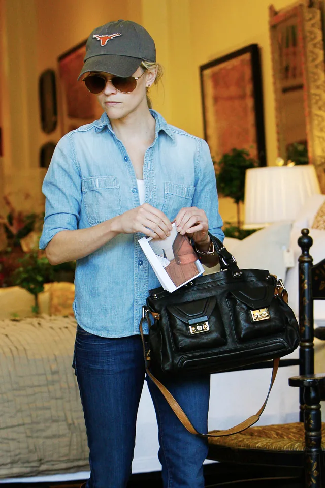 Reference image illustrating Reese Witherspoon’s Designer Handbag Collection: A Style Icon’s Most Worn Bags