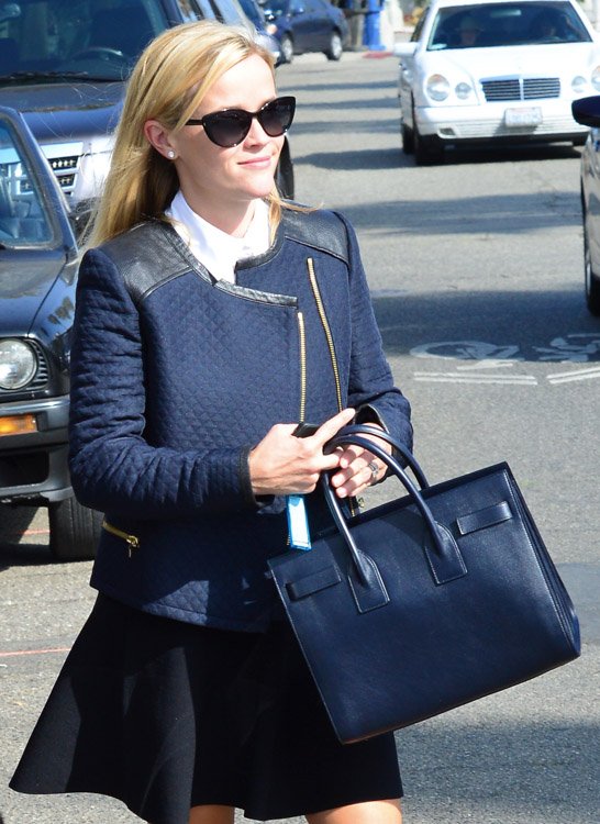 Reference image illustrating Reese Witherspoon's Handbag Collection: A Second Look at Her Best Designer Bags