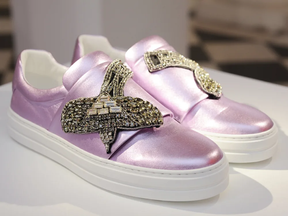 Reference image illustrating Spring 2017 Runway Footwear Trends: Sneakers, Stilettos, and Statement Mules