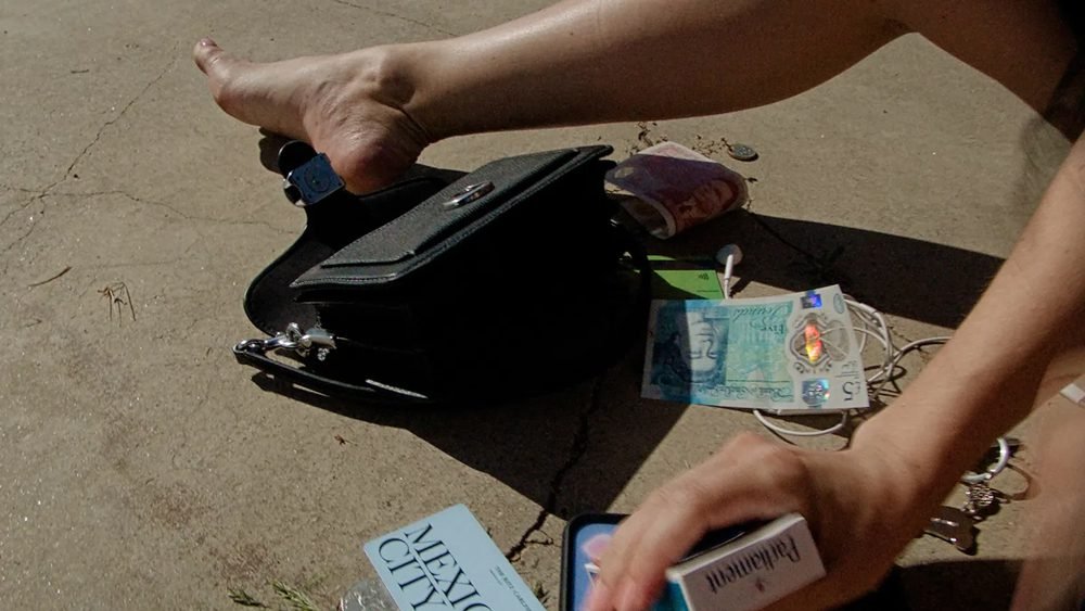 Reference image illustrating The Iconic Prada Nylon Bag That Launched Carrie Bradshaw's Legacy on Sex and the City