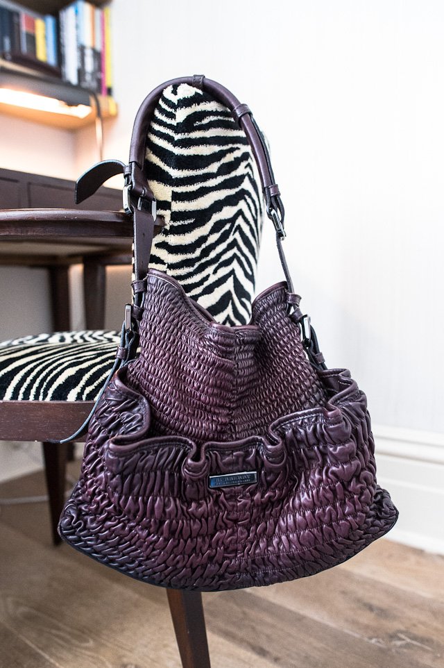 Reference image illustrating What’s Inside Margaret Hyde’s Handbag: A Luxe Plum Leather Edit