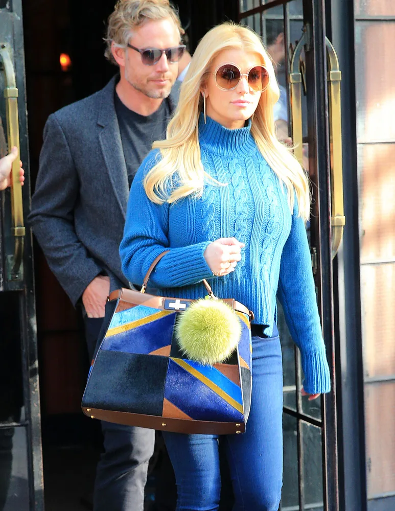 Reference image illustrating Why Jessica Simpson Chooses Oversized Designer Bags Over Mini Trends