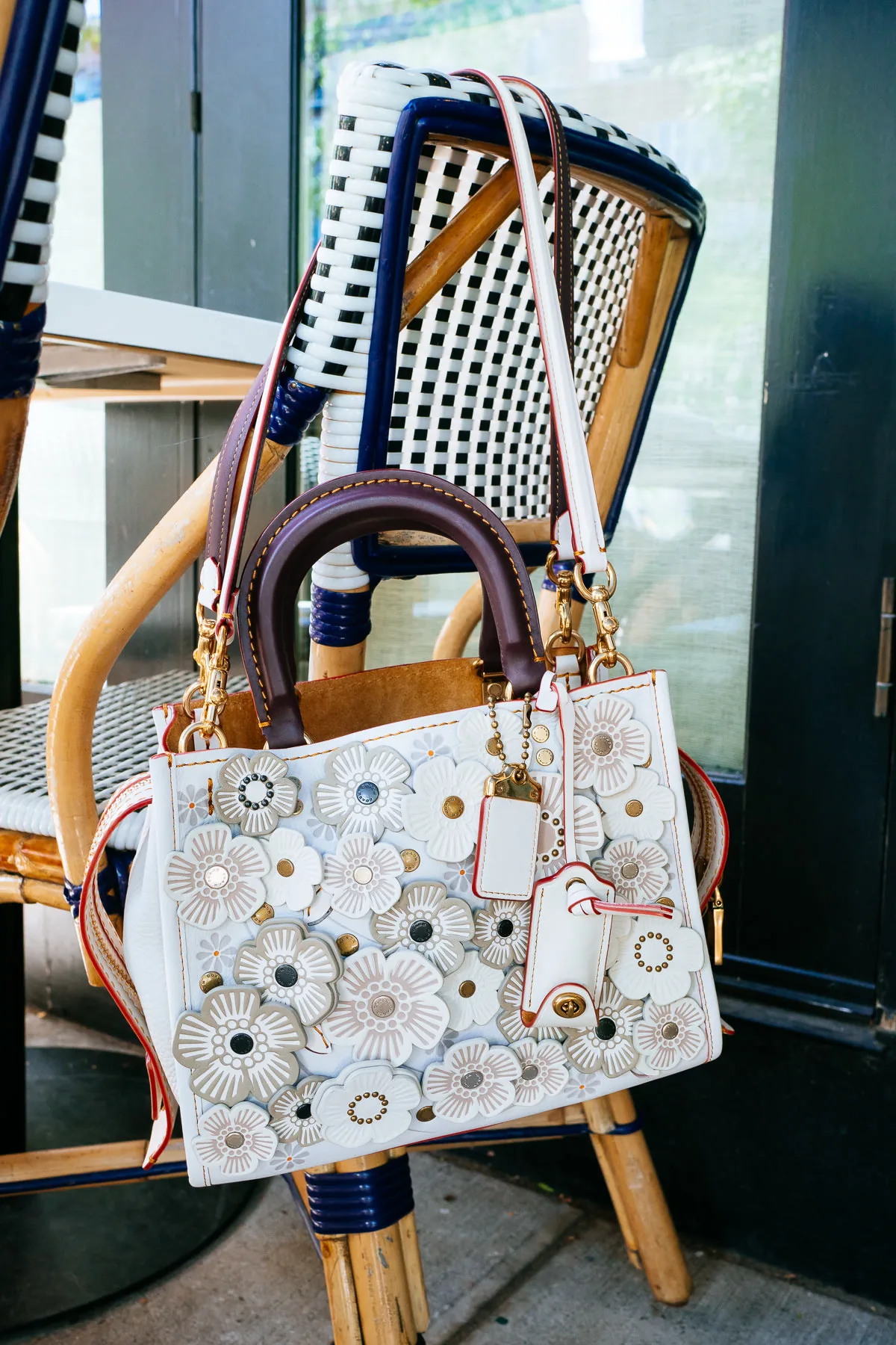 Reference image illustrating Styling Coach’s Glitter Tea Rose Bags at NYC’s Cafe Clover: A Luxury Lunch Guide