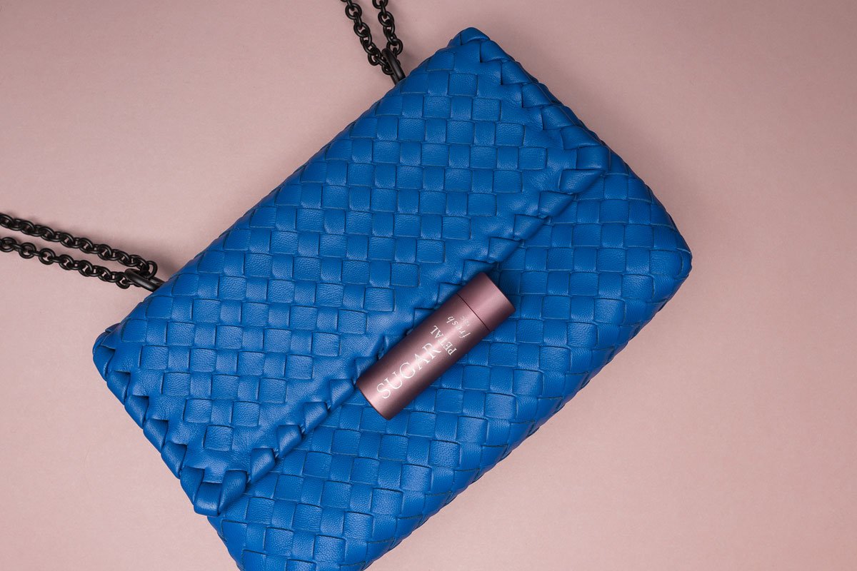 Reference image illustrating The Fresh Sugar Lip Treatment: A Luxury Handbag Essential for Hydrated, Tinted Lips