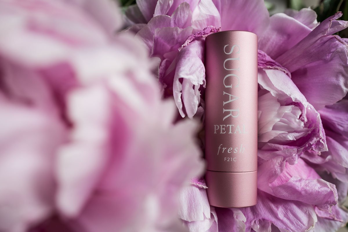 Reference image illustrating The Fresh Sugar Lip Treatment: A Luxury Handbag Essential for Hydrated, Tinted Lips