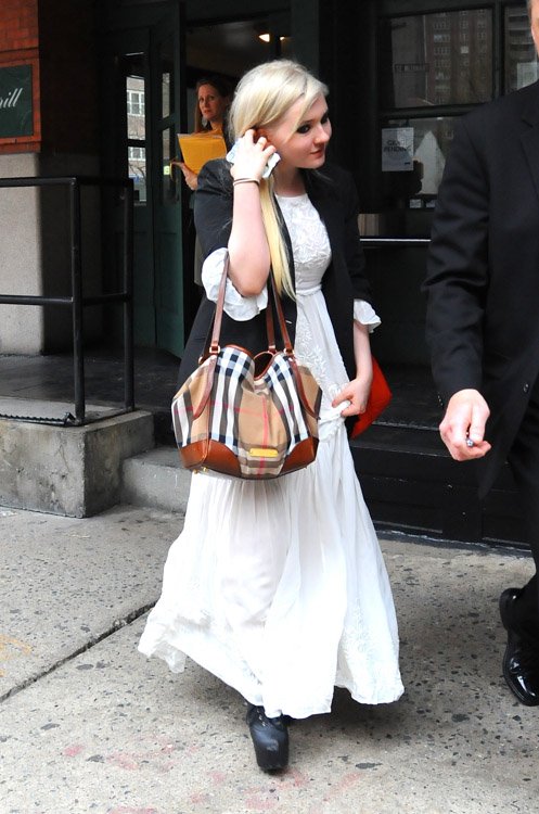 Reference image illustrating Abigail Breslin's Burberry Canterbury Shoulder Bag: A Grown-Up Street Style Moment in NYC