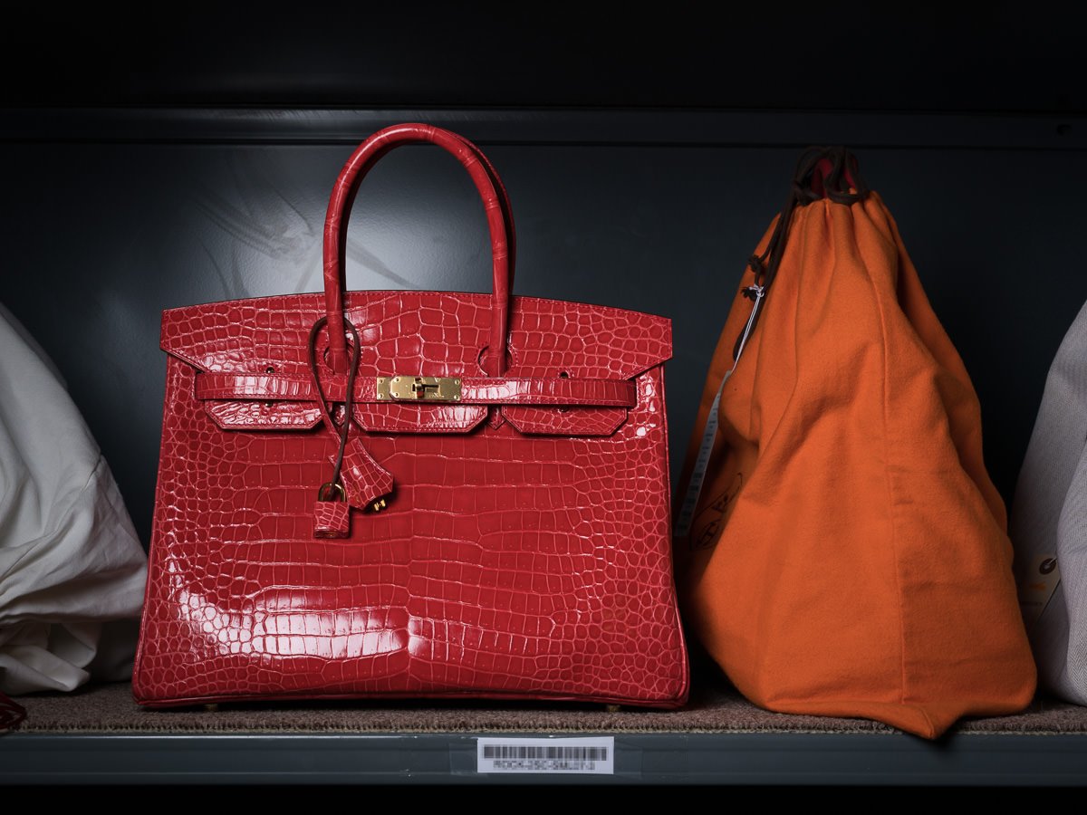 Reference image illustrating Birkin vs Kelly: Which Red Hermès Bag Commands the Auction Block?