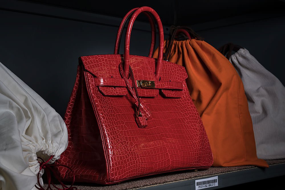 Reference image illustrating Birkin vs Kelly: Which Red Hermès Bag Commands the Auction Block?