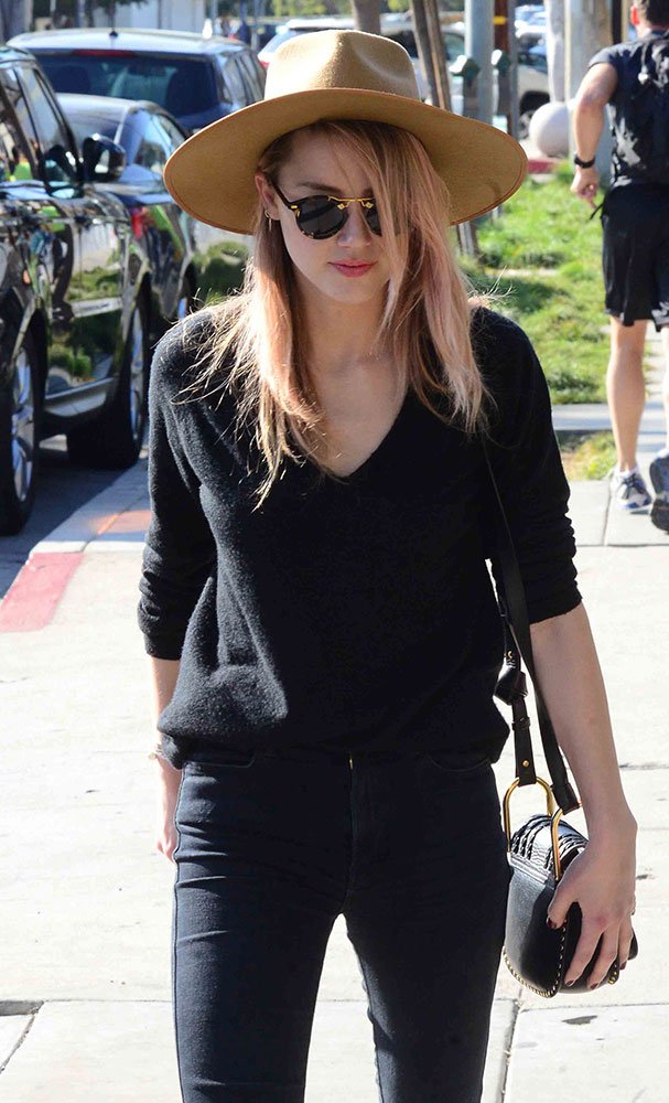 Reference image illustrating Celebrities Embrace All-Black Luxury Handbags: Gucci, Chloé, Hermès, and More