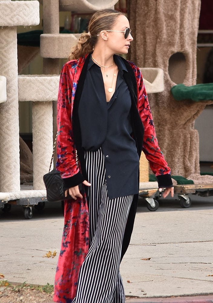 Reference image illustrating Celebrity Airport Style: Chanel, Prada, and Givenchy Bags Spotted Before Holiday Travel