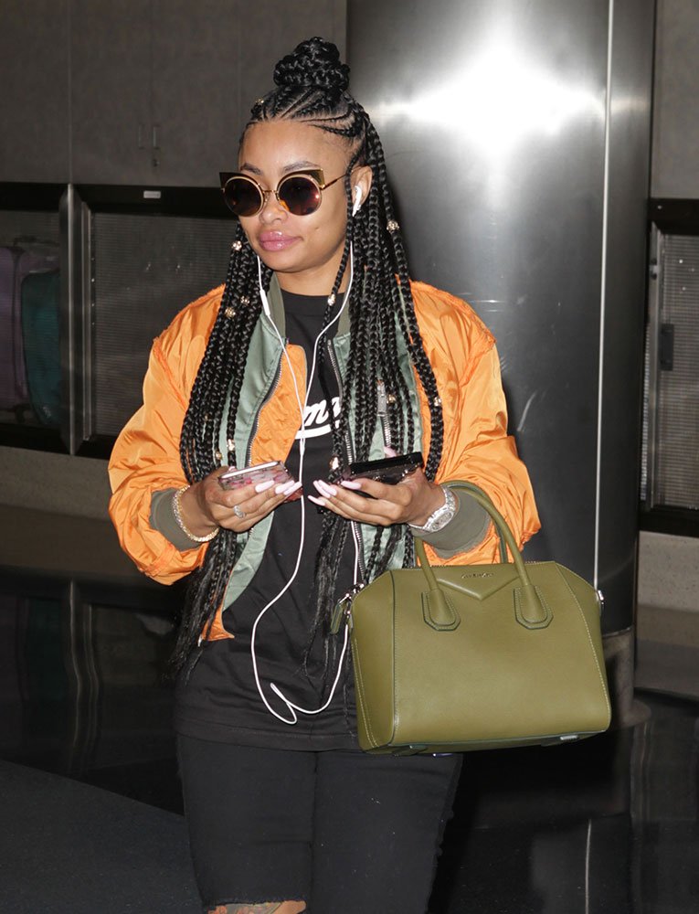 Reference image illustrating Celebrity Handbag Sightings: Chanel, Versace, and Hunting Season Bags Spotted on Summer Errands