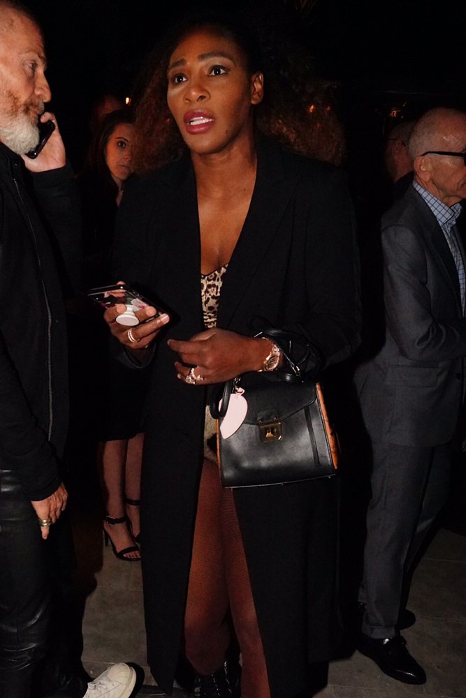 Reference image illustrating Celebrity Handbag Sightings: Milan Fashion Week Finale with Prada, MCM, and Chloé