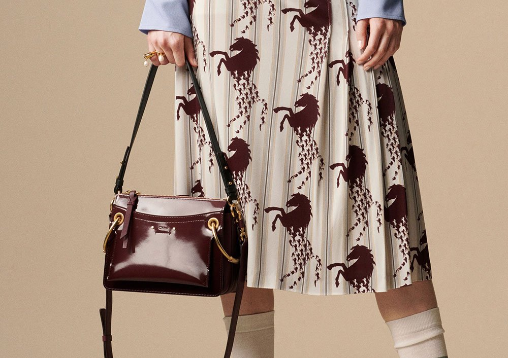 Reference image illustrating Chloé Resort 2019 Bags: Logo Hardware and Printed Brand ID Debut